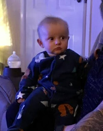 Baby boy stares suspiciously