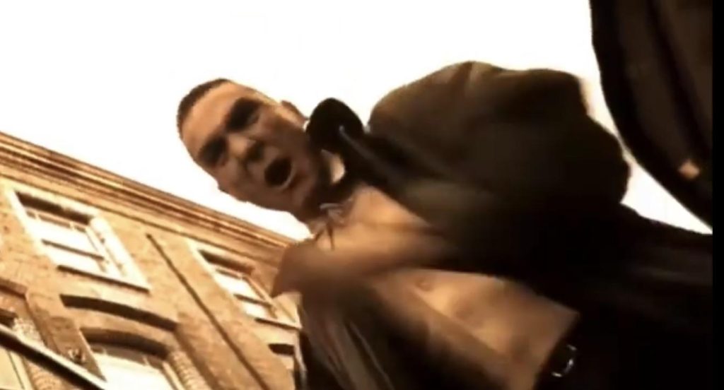 A still from the film 'Lock Stock and Two Smoking Barrels', where Vinnie Jones's character is in the act of slamming his son's attacker in a car door.