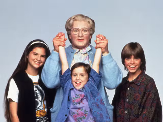 Mrs Doubtfire and the three children in her family.